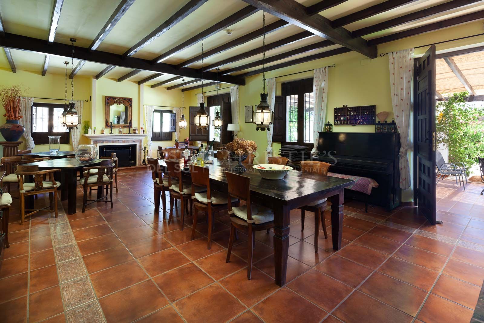 A comfortable living room, bar, dining room and terrace
